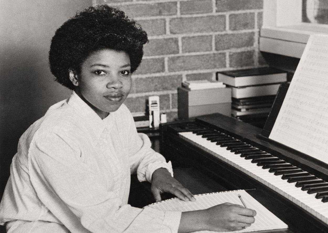 Young Shirley J. Thompson at a piano